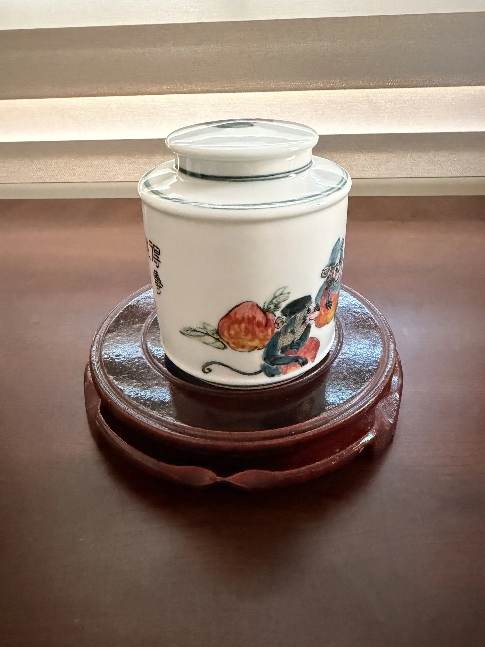 Handcrafted Ceramic Tea Jar with Playful Monkey and Peach Motifs