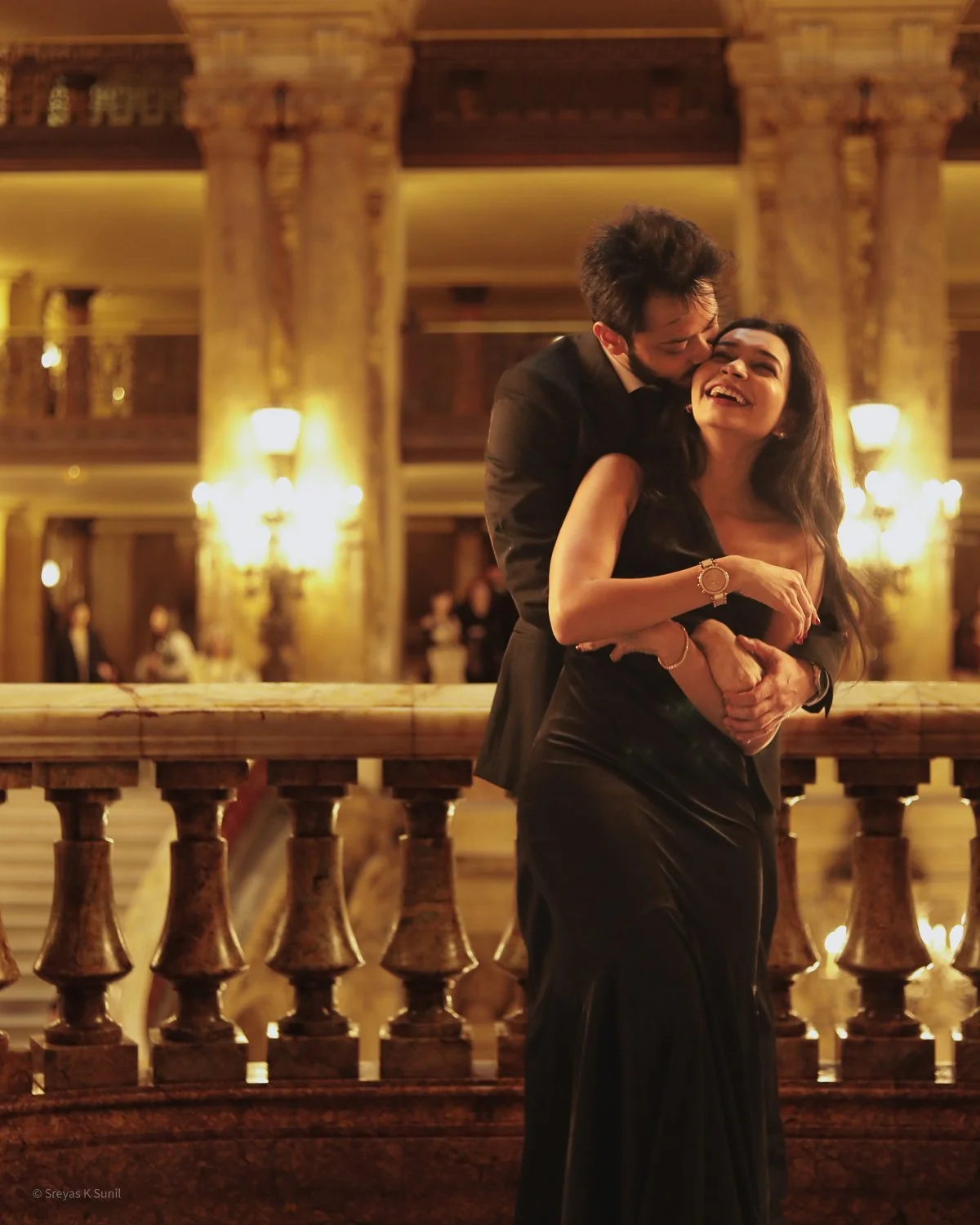 A couple enjoying a romantic moment at the Paris Opera.