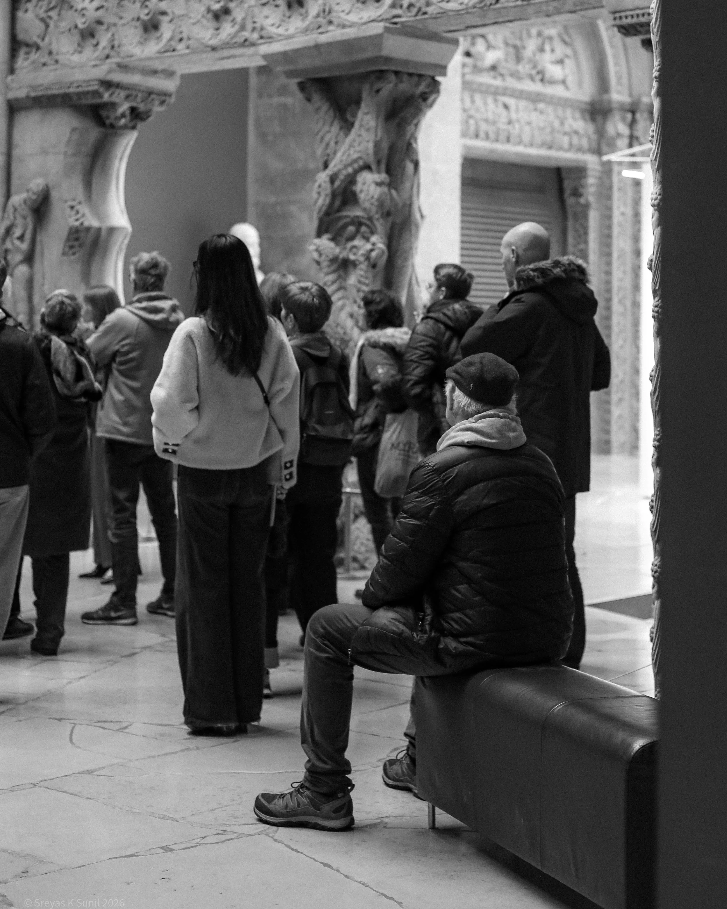 A group of people standing and enjoying the museum