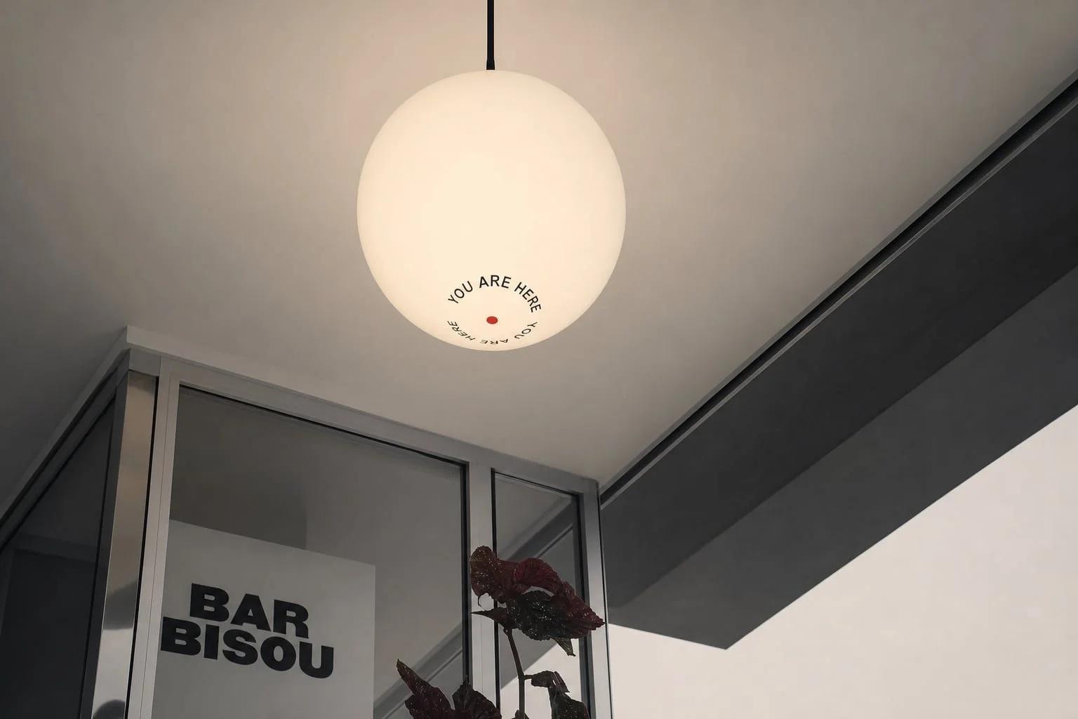 You Are Here pendant lamp with a map-inspired marker.