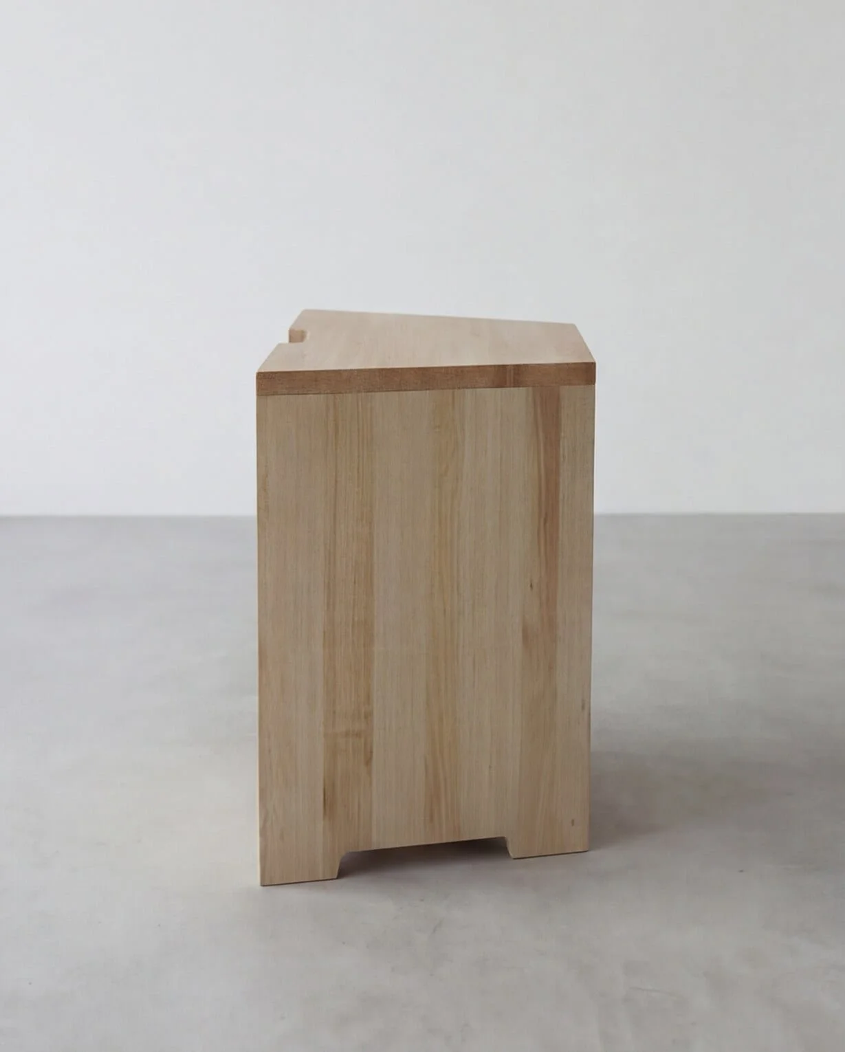 Side view of the Arbetshäst wooden stool.