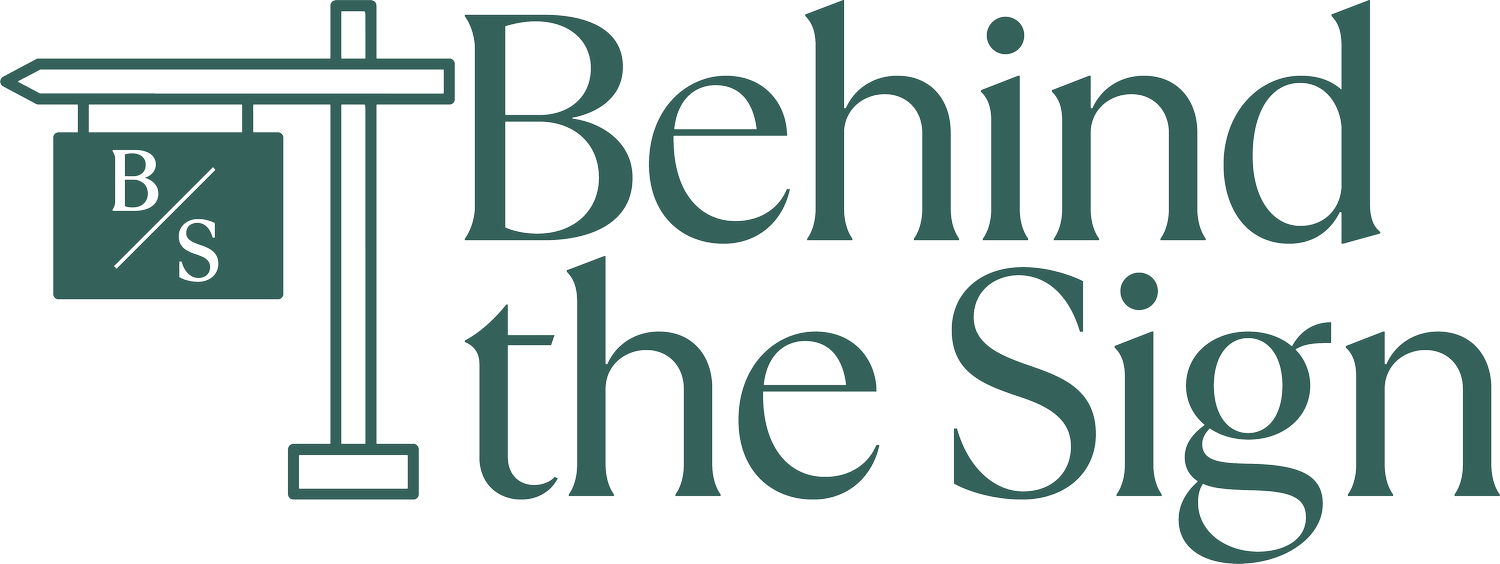 Behind the Sign