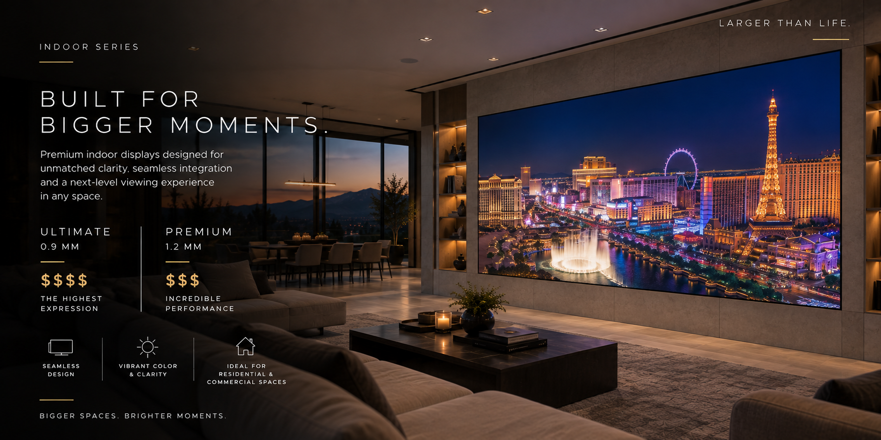 Living room with large flat-screen TV displaying a cityscape at night, with text overlay promoting premium indoor displays. The room has a modern design with a seating area, candles, and window views of mountains at sunset.
