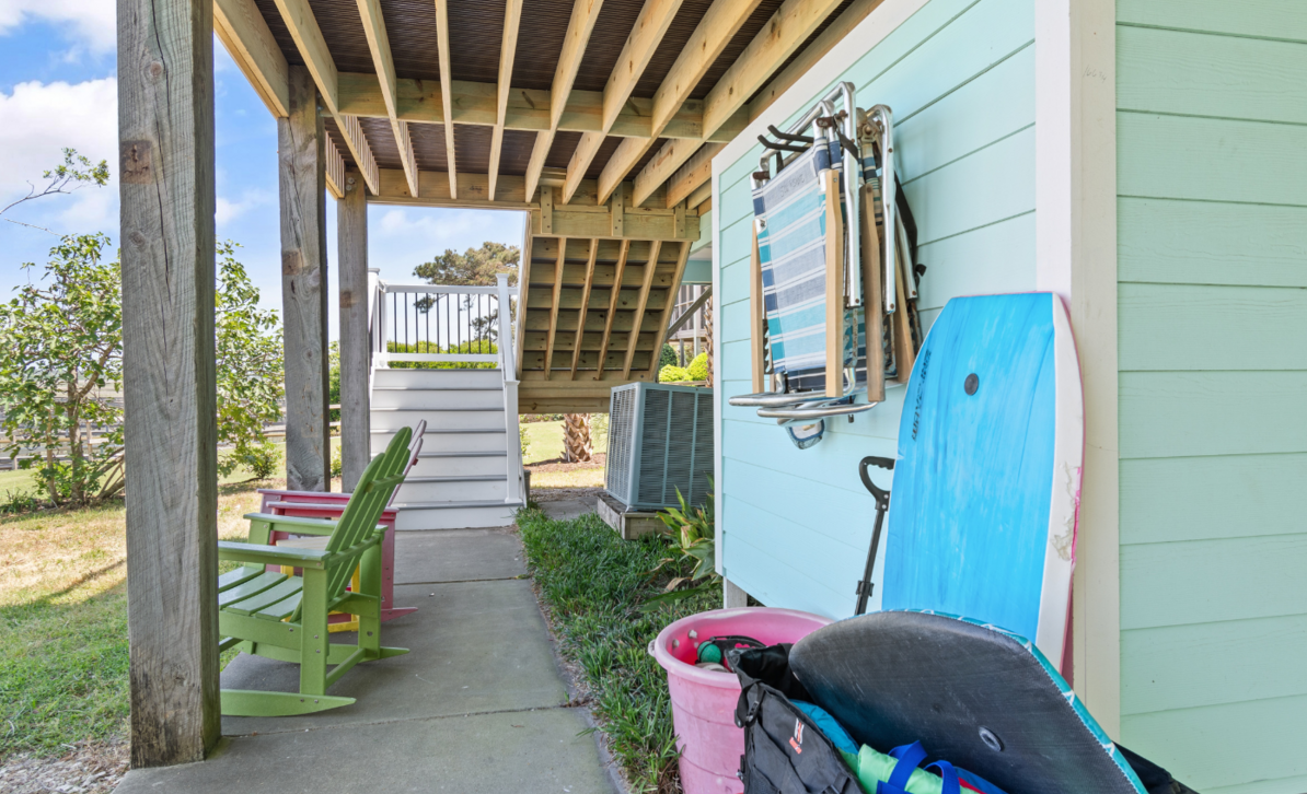 Under the house at El Sol with outdoor seating and beach gear ready to go.