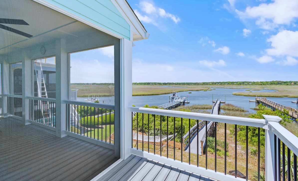 Tidal marsh view near the Intercoastal Waterway from El Sol's balcony in Sunset Beach, North Carolina, with a private dock