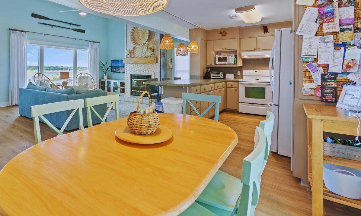 Open living and dining area at El Sol with a breakfast bar and a sitting area by the window."