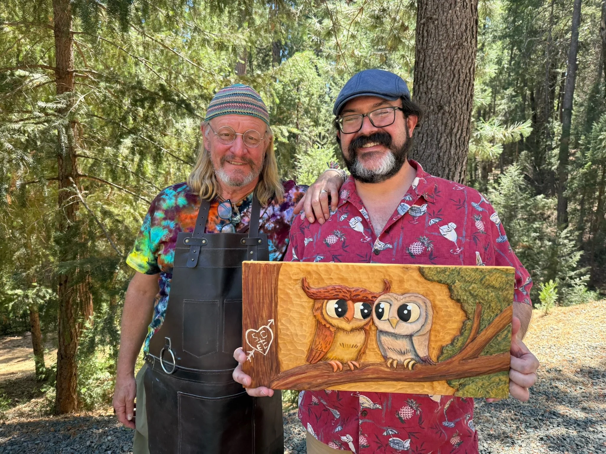 Raymond Kinman and Sam Carter with wood carving by Sam. at Raymond Kinman's Artist Retreat