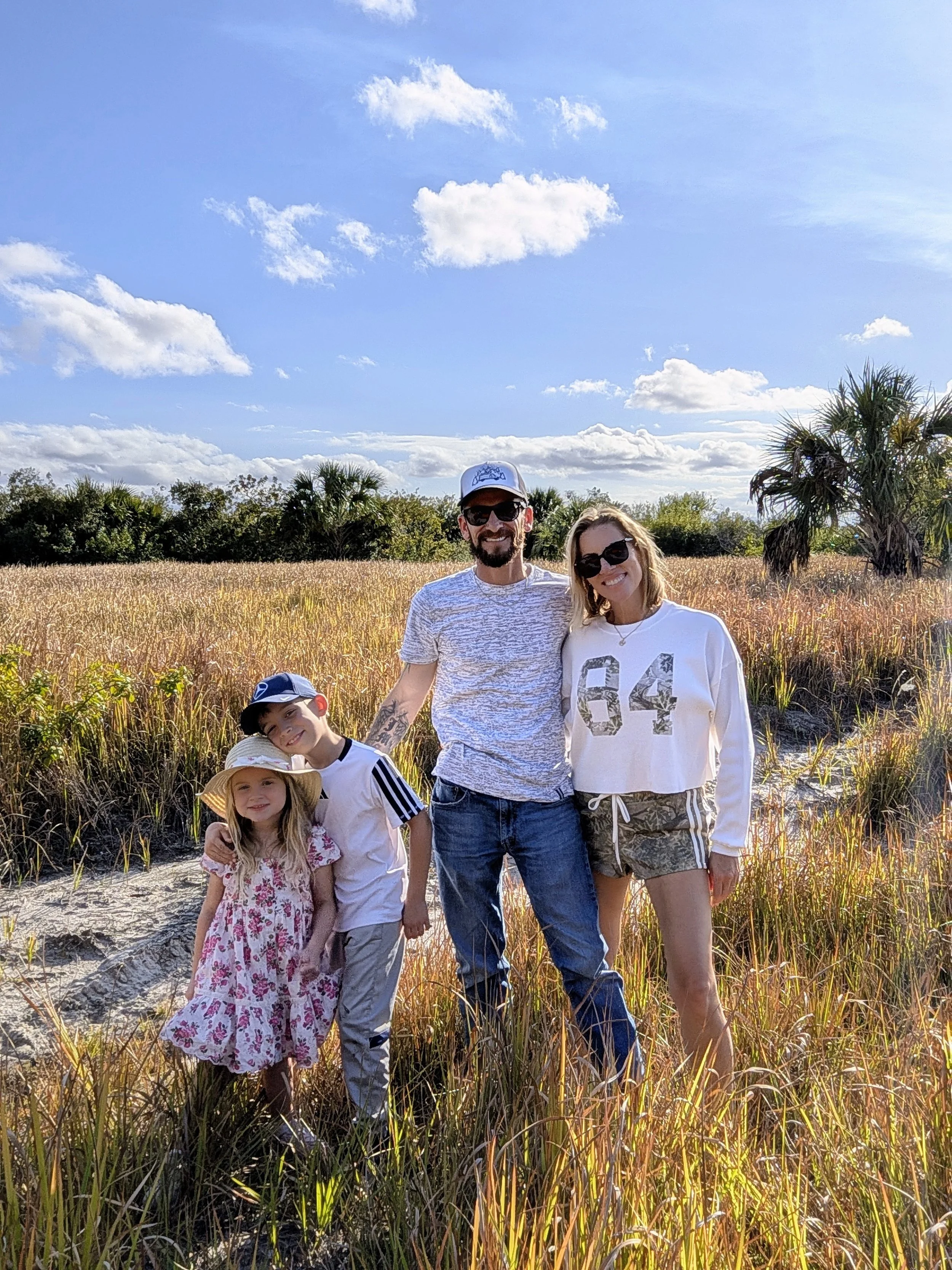 Johnny and Tiffany with their two kids, the family behind Salty Crew pool care in Brevard County