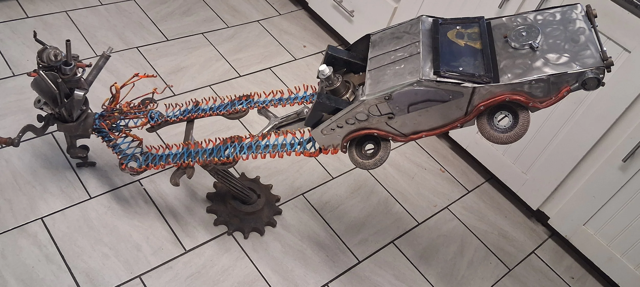 Where We're Going, There Is No Parkinson's: scrap metal DeLorean sculpture by Sean McFall