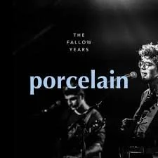 Album cover for Porcelain by The Fallow Years featuring a black and white photo of two musicians, with one playing the guitar, and the band name and album title displayed.