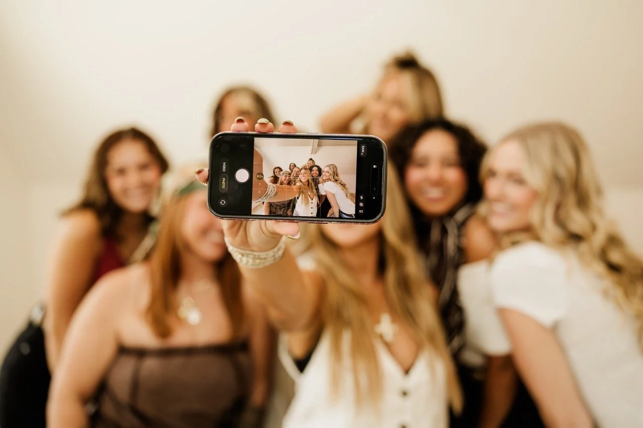 Group of young women taking a selfie with a smartphone