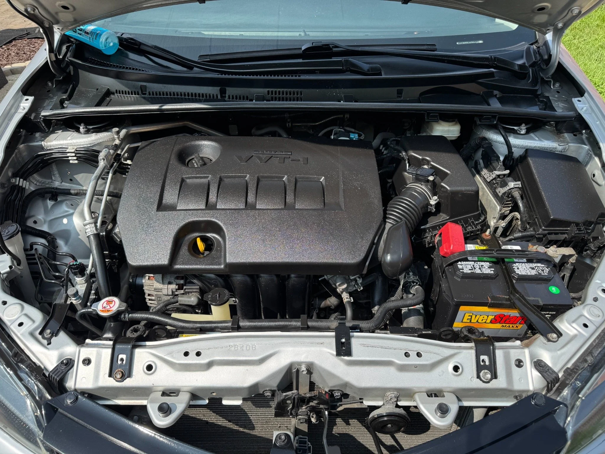 Toyota engine compartment after engine bay cleaning by Alpha Car Detailing in Des Plaines Illinois