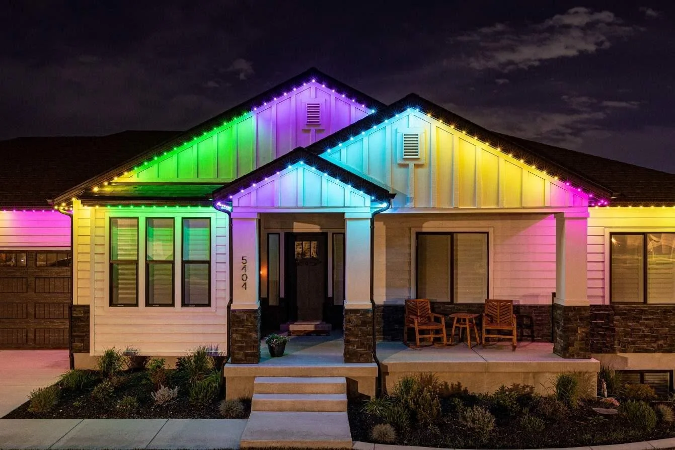 Colorful house decorated with multicolored string lights at night