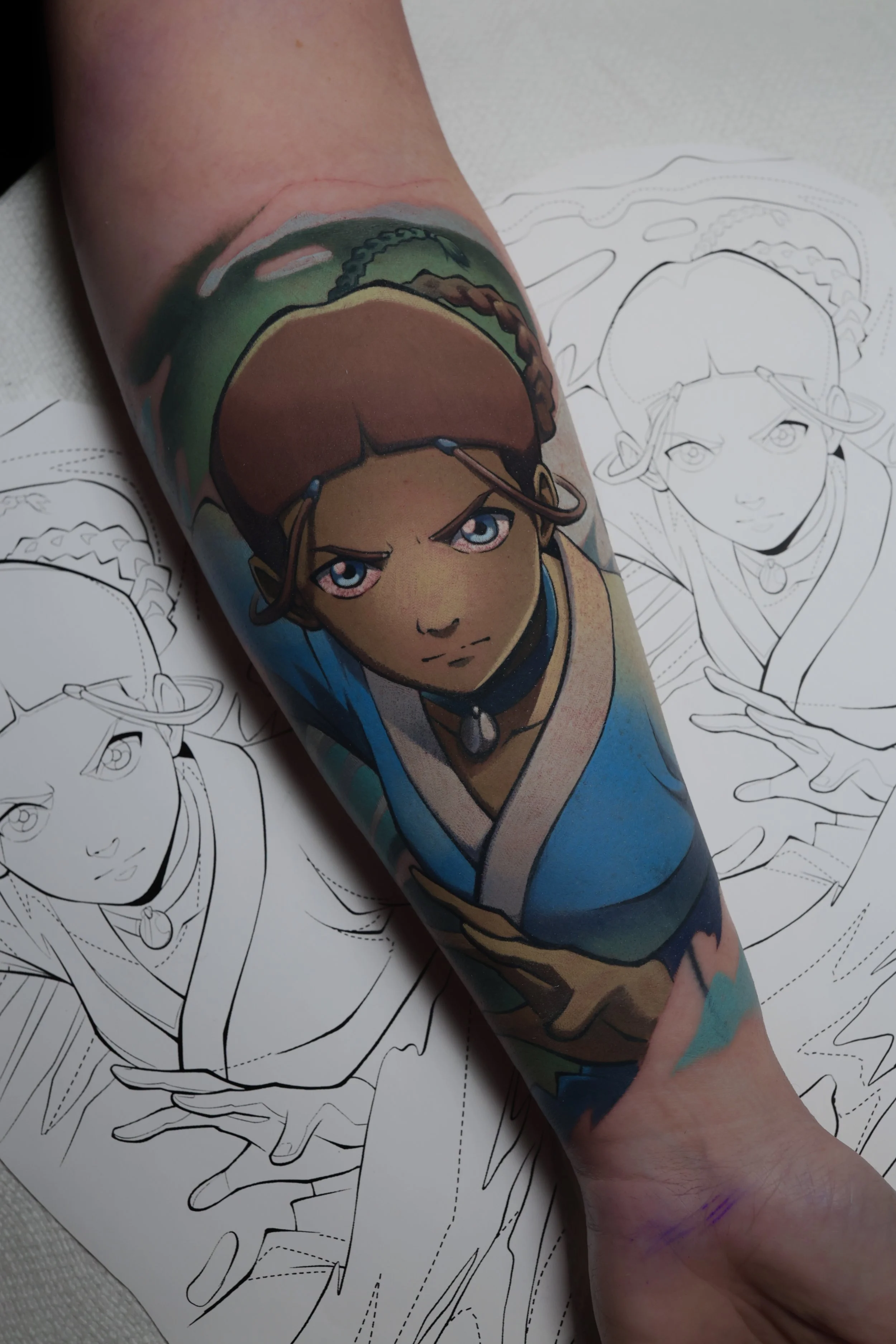 Colorful tattoo portrait of Katara from Avatar the last airbender