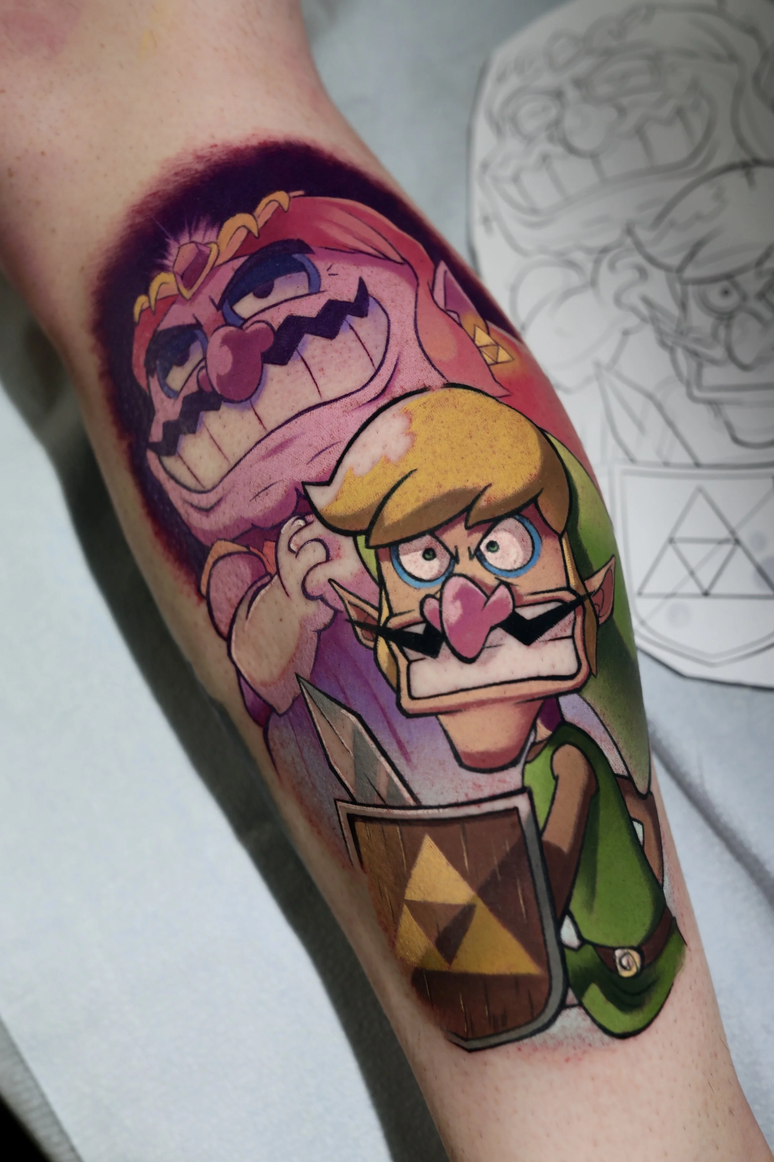 Colorful tattoo of wario dressed as zelda in the backround and Waluigi dressed as link