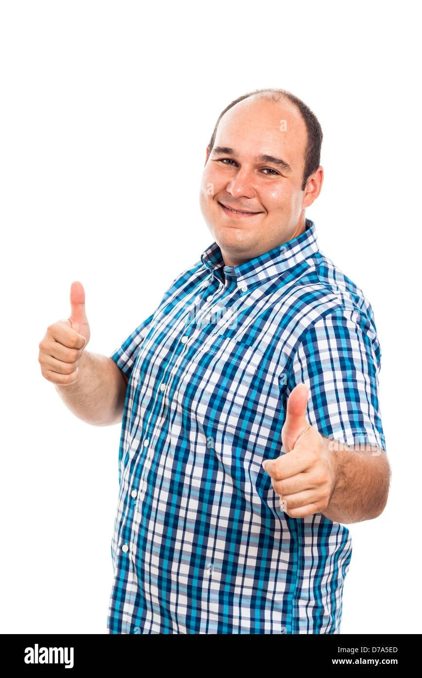 A smiling man wearing a blue plaid shirt giving two thumbs up.