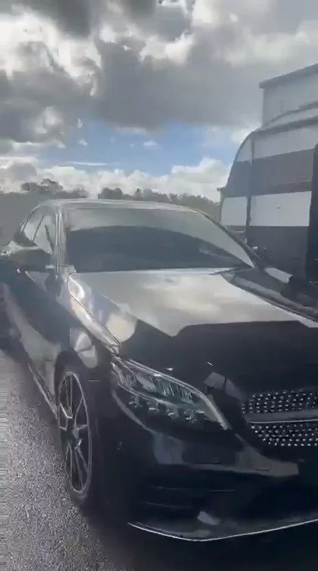 The black Mercedes rinsed down during the exterior wash.