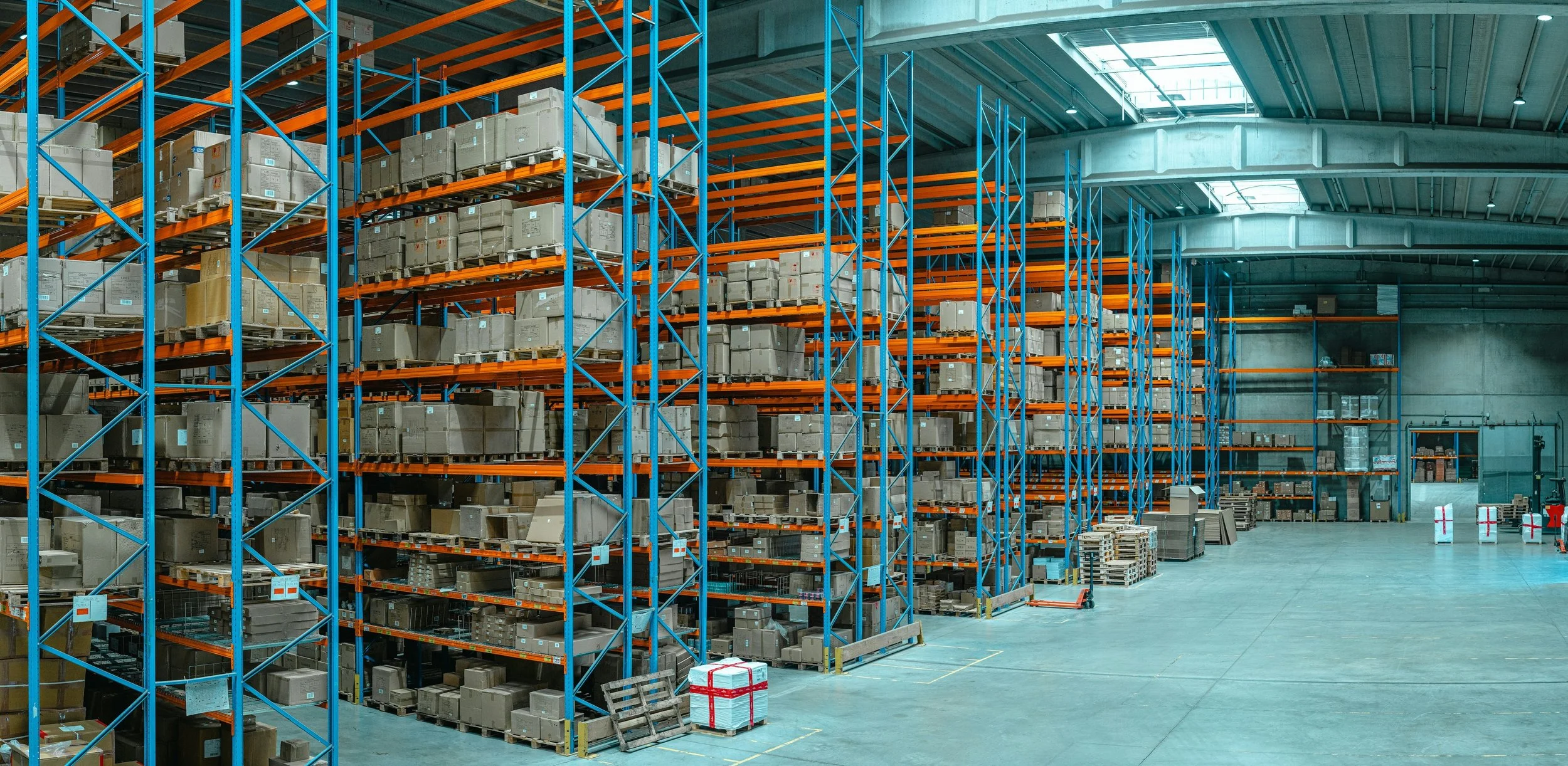 Warehouse interior with organized storage racks and inventory.