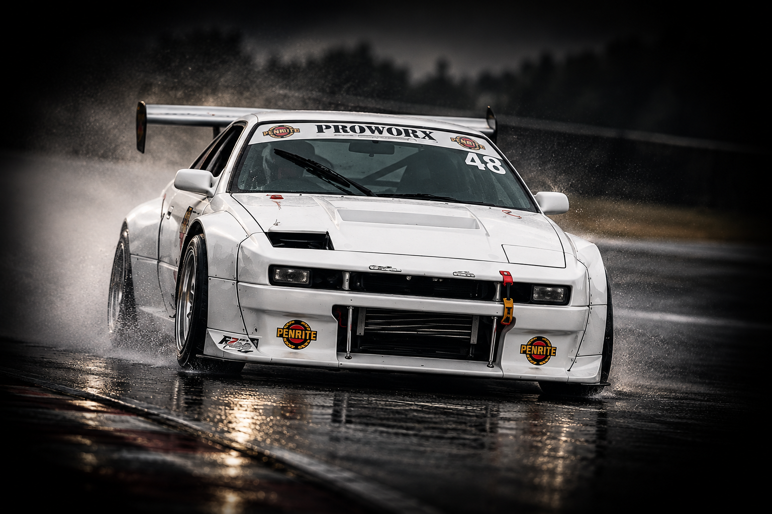Mark’s white Proworx Racing car competing on track during a motorsport event.