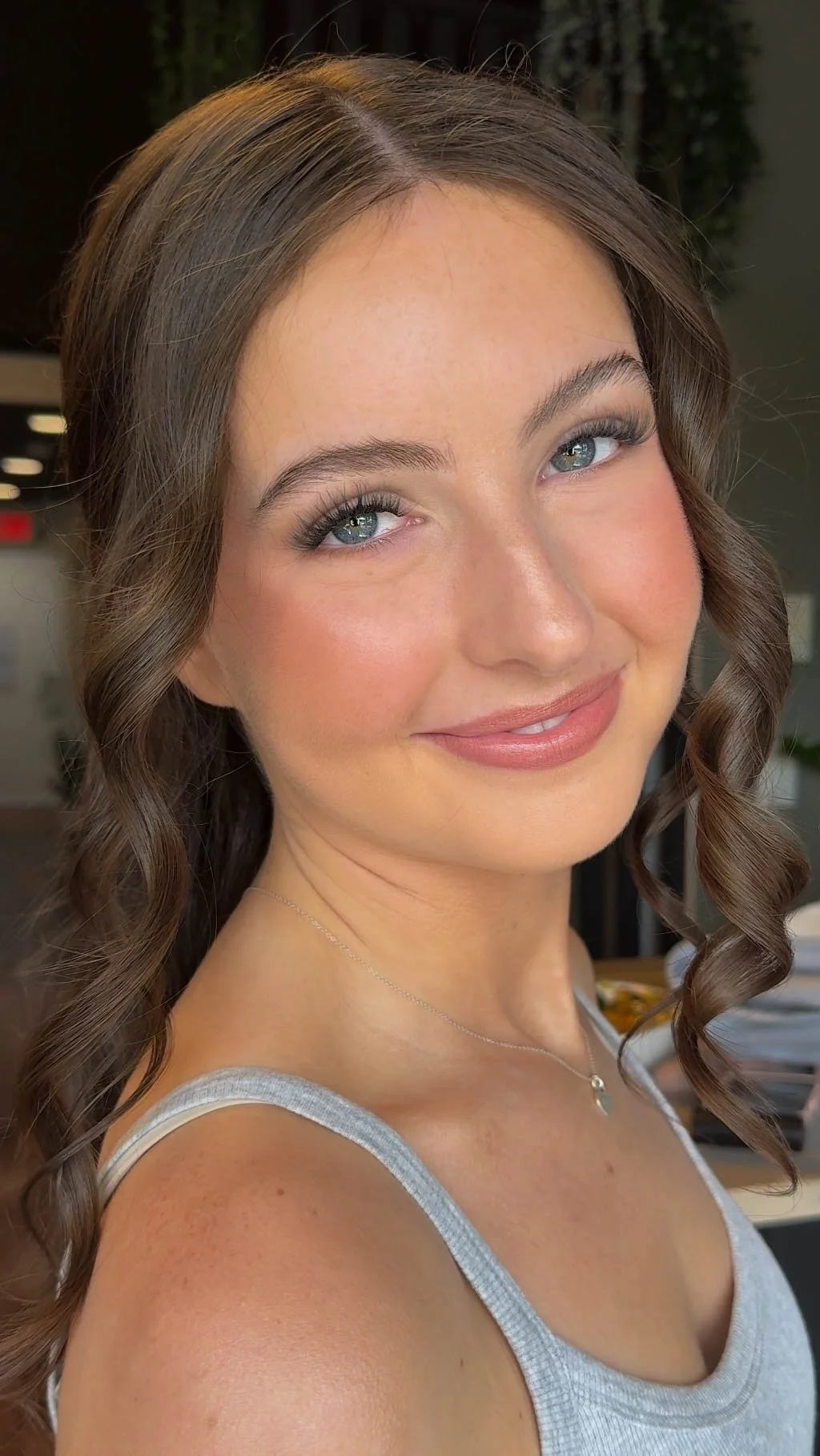 Soft romantic makeup with radiant skin, rosy tones and softly defined eyes.