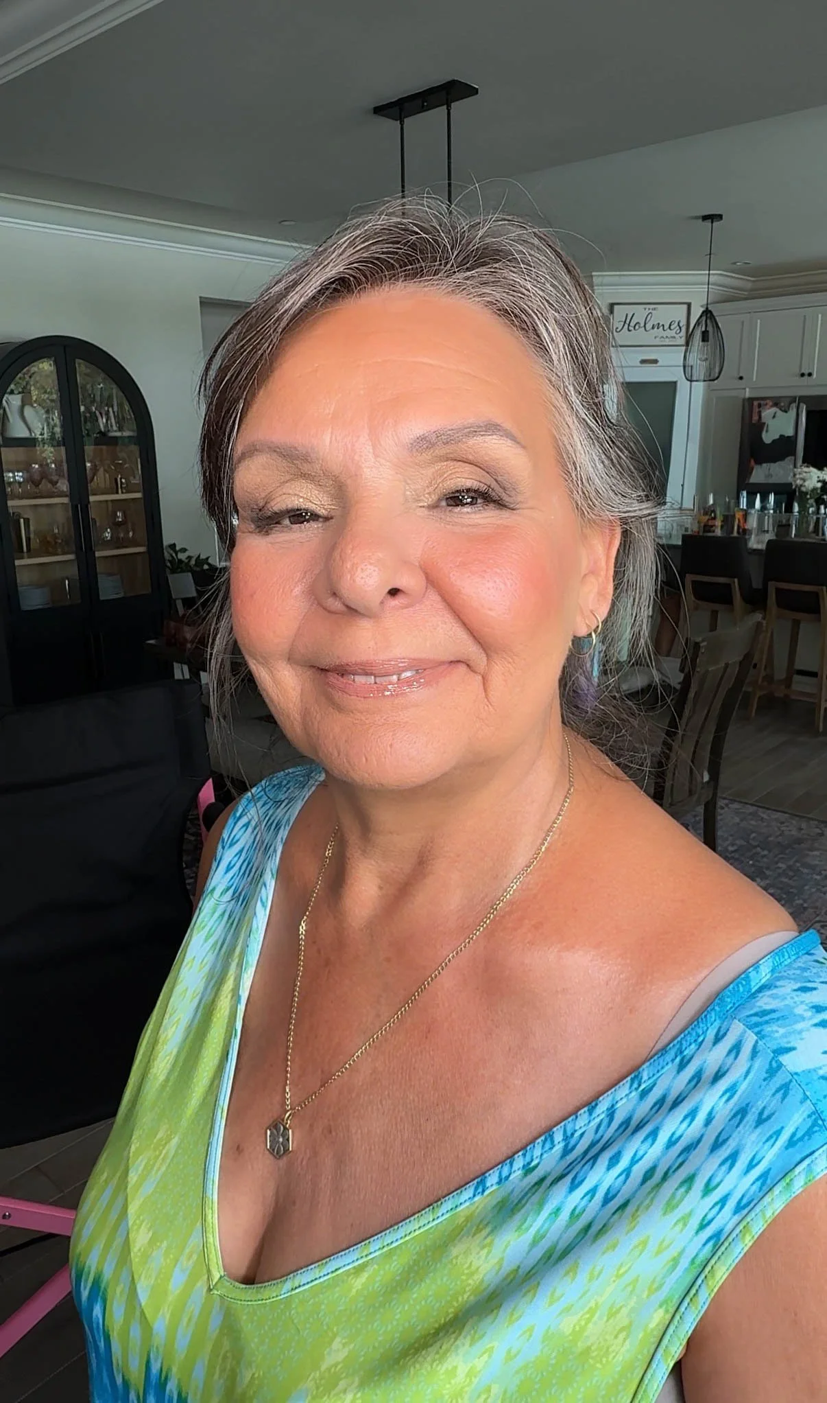 Elegant makeup on mature skin with luminous skin, soft eyes and a natural pink lip.