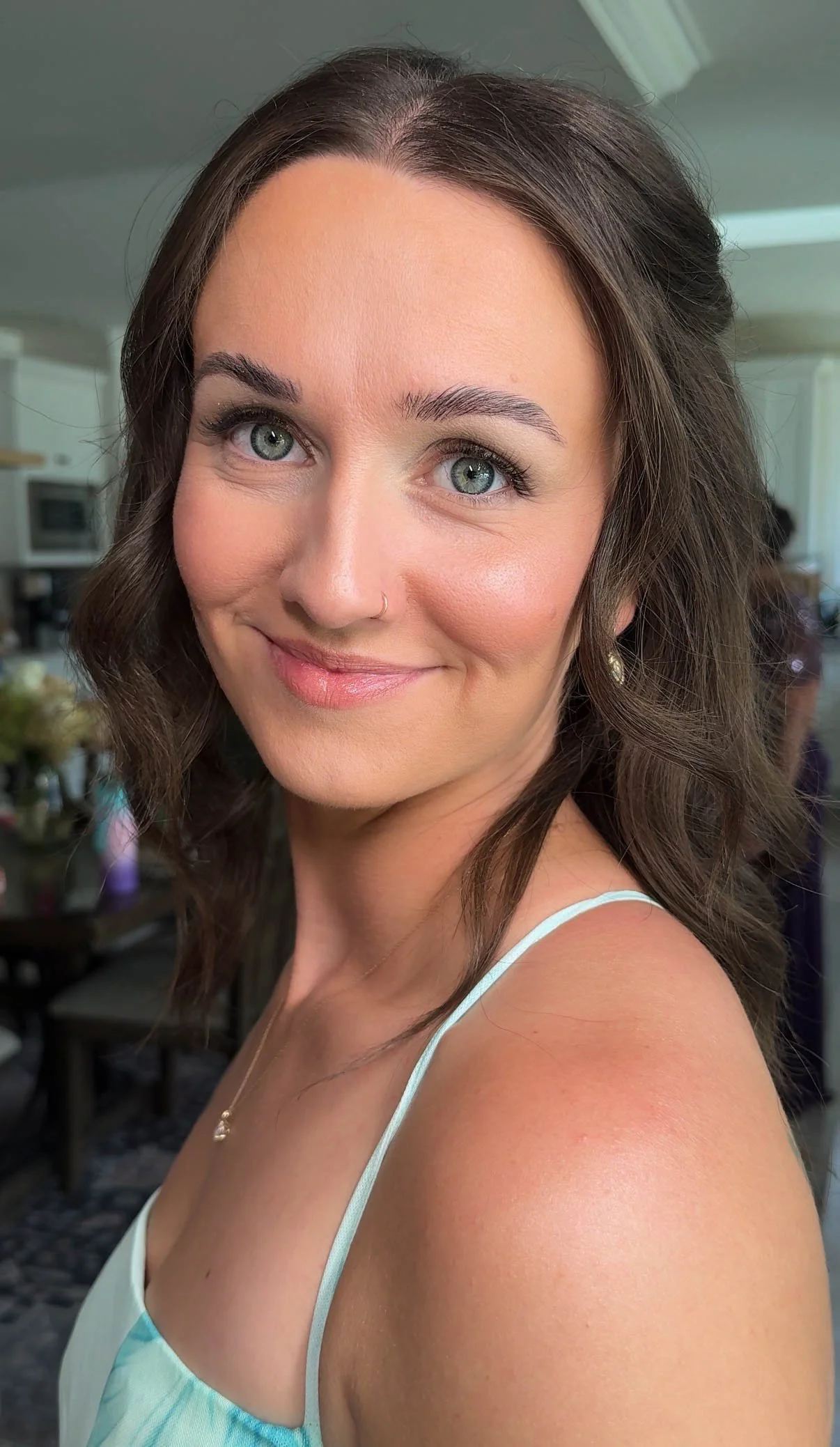 Fresh natural makeup with glowing skin, rosy cheeks and softly defined eyes.