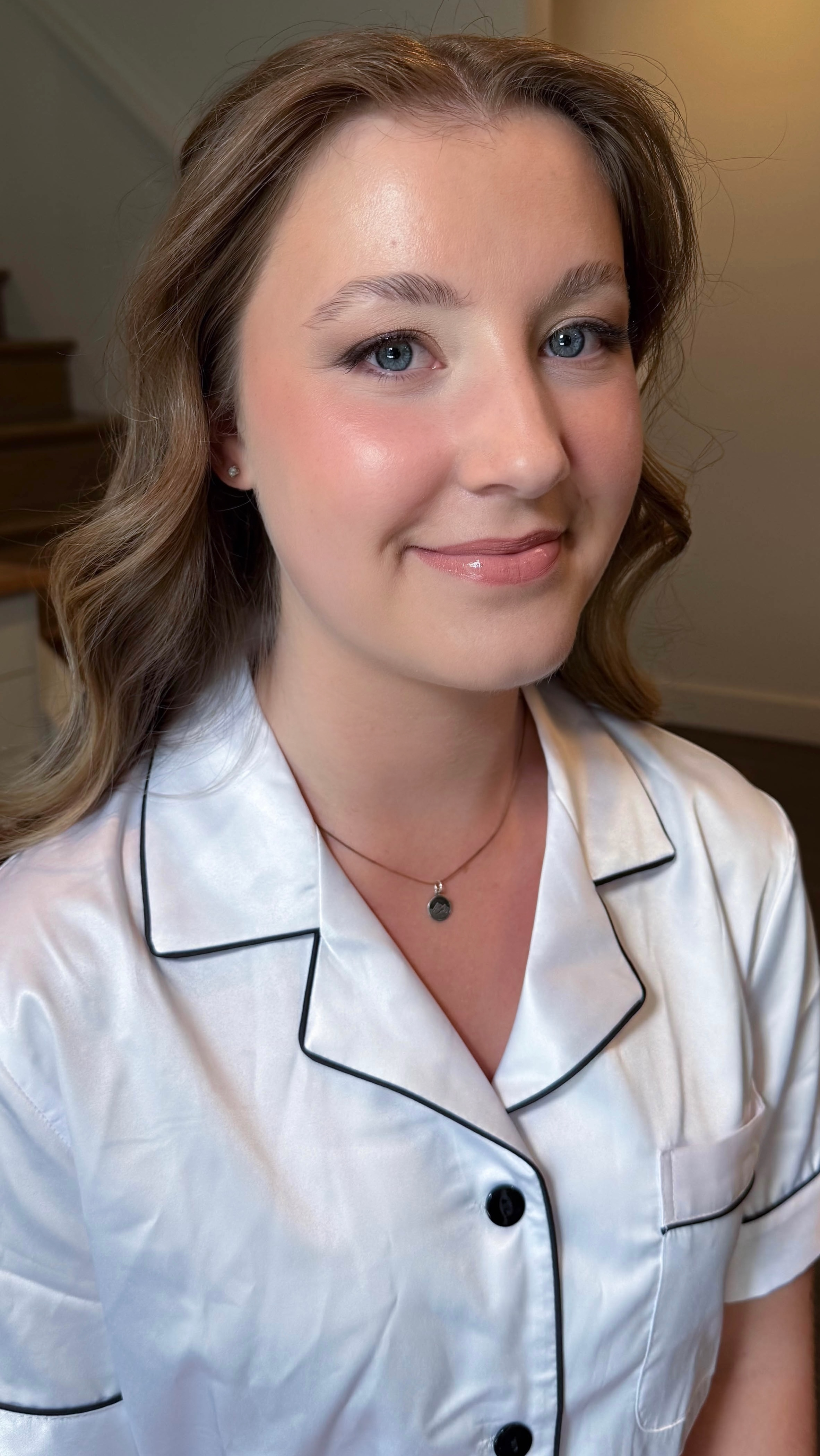 Fresh natural makeup with glowing skin, rosy cheeks and subtle eye definition.