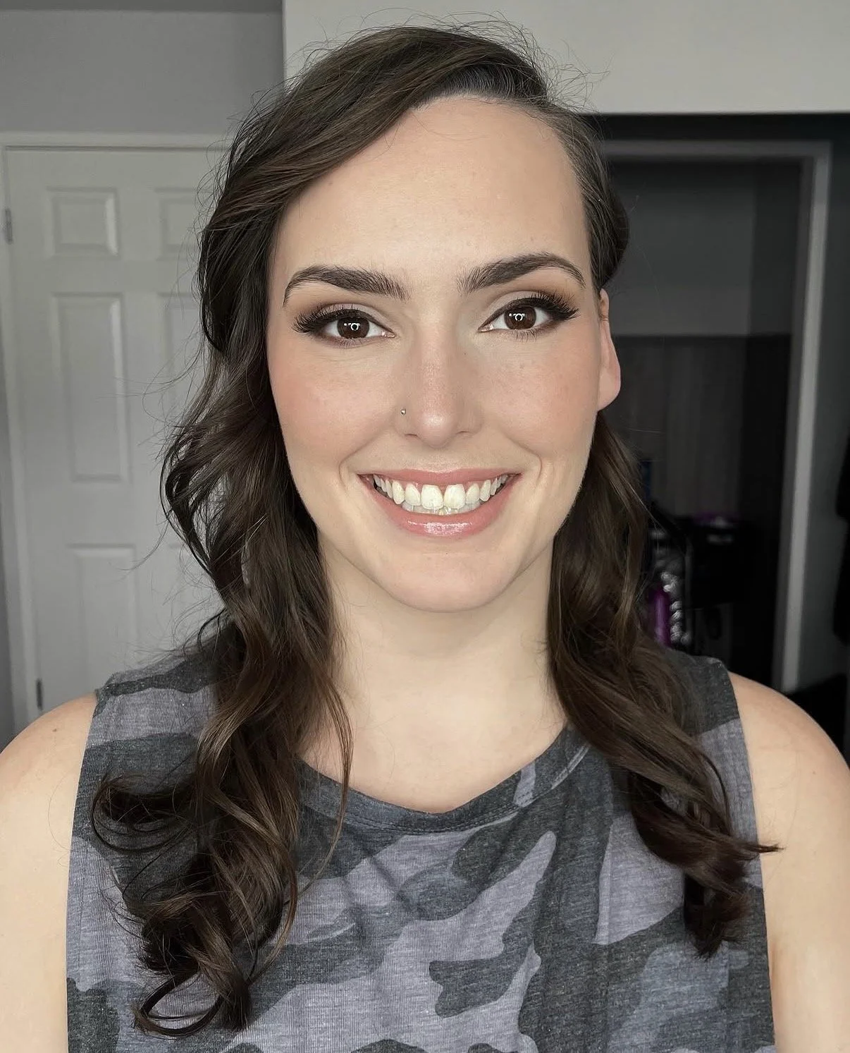 Defined soft glam with flawless skin, smoky eyes and a soft neutral lip.