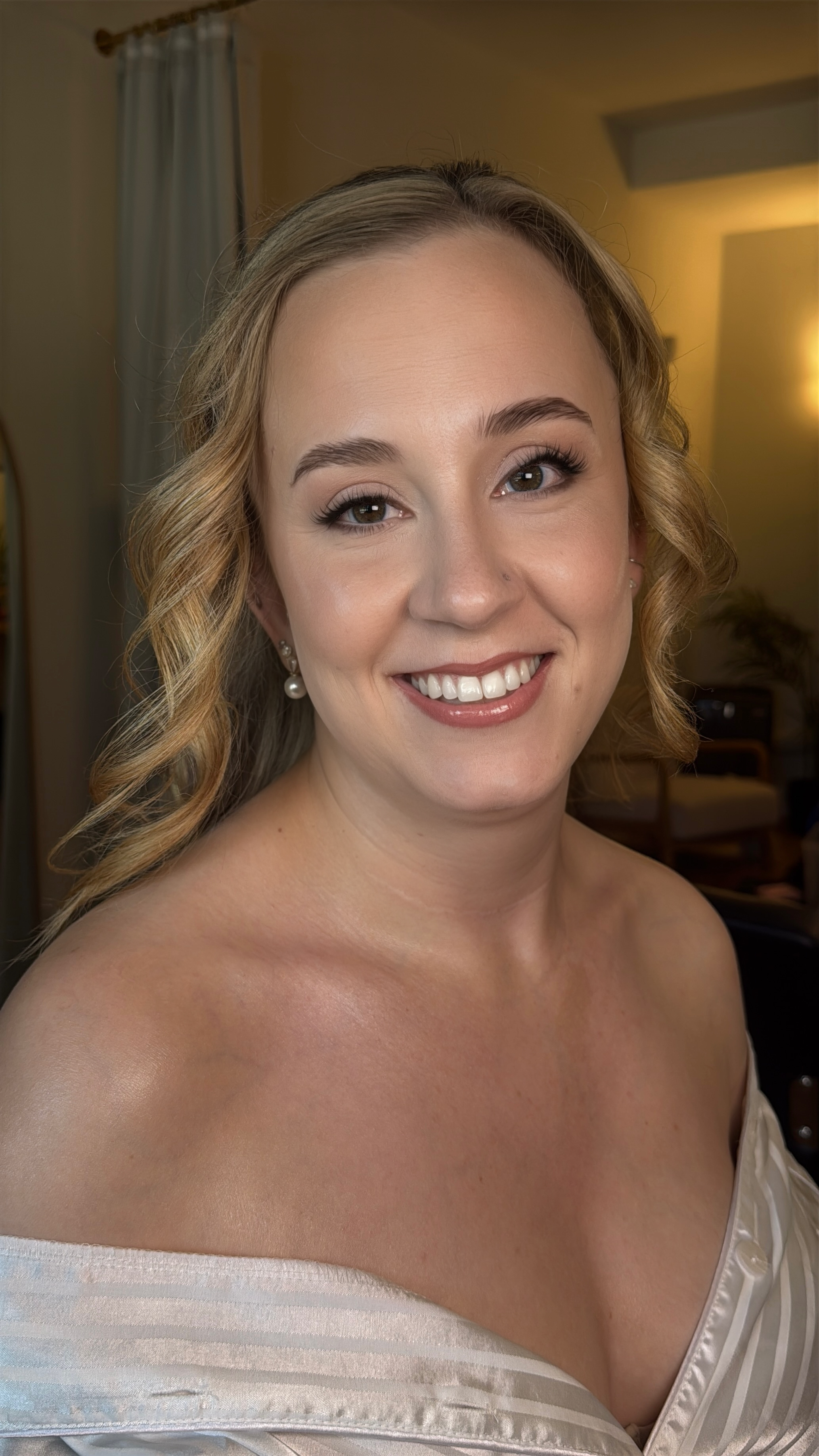 Classic bridal makeup with radiant skin, soft eye definition and a natural lip.
