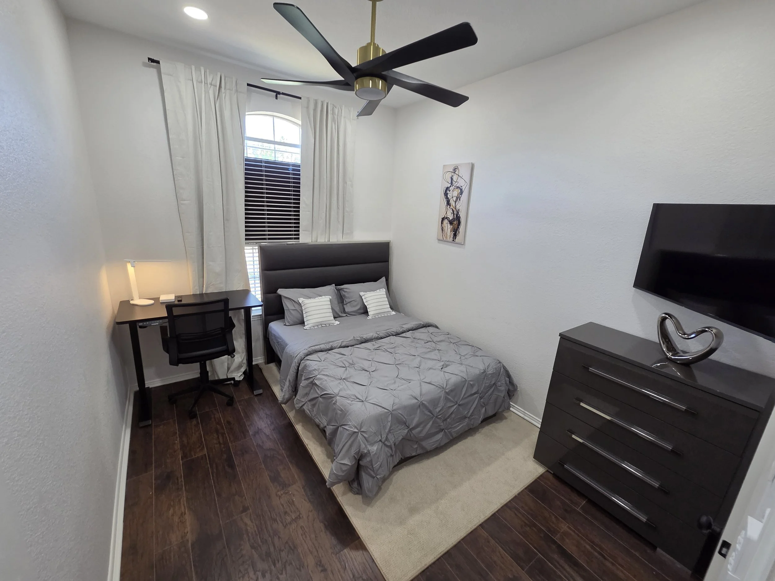 Bedroom workspace at Ivory House McKinney, perfect for remote work.