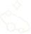 A close-up of a black and white cat lying on its side on a patterned blanket.