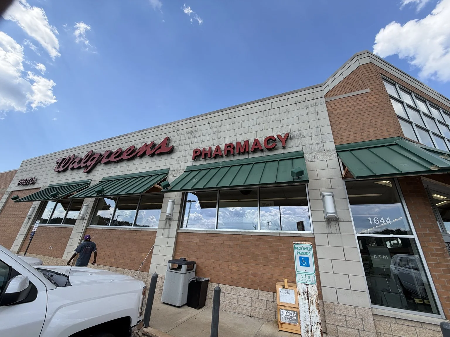 Walgreens commercial cleaning project — storefront windows and green awnings.