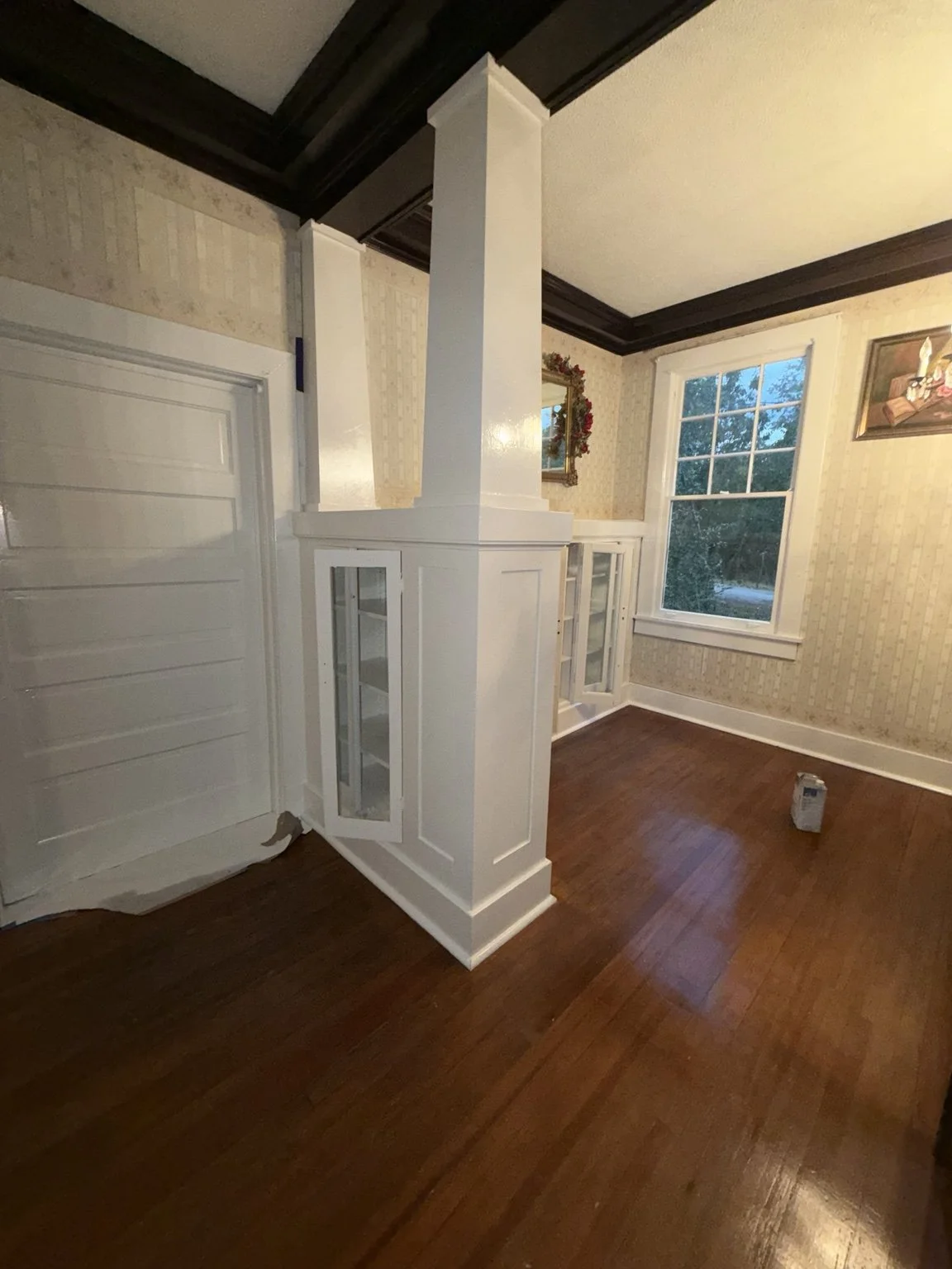 Lewisville residential painting — white-painted column, cabinetry and paneling.
