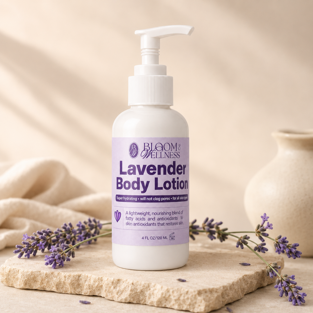 A white bottle of Lavender Body Lotion with a pump dispenser on a stone surface, surrounded by sprigs of lavender and a beige cloth, with a cream-colored vase in the background.