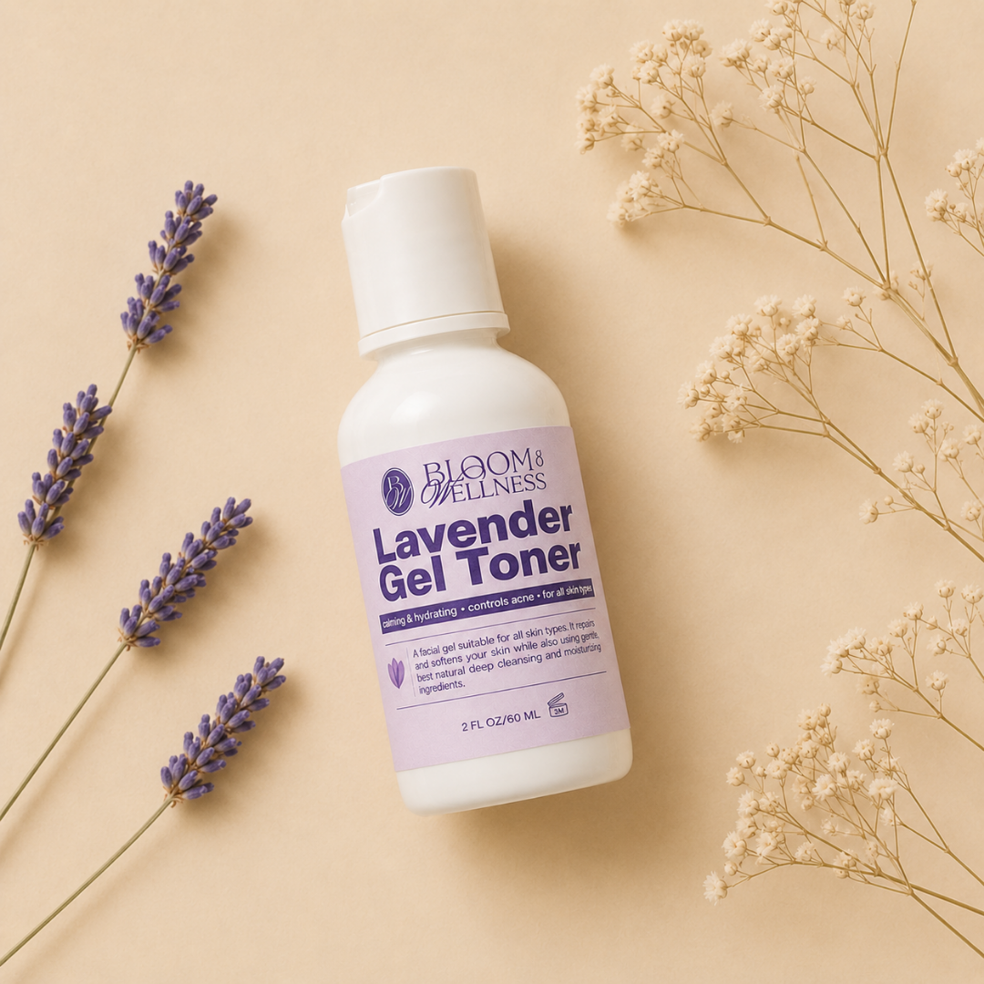 A bottle of Bloom Wellness Lavender Gel Toner placed on a beige surface, surrounded by sprigs of lavender and dried white flowers.