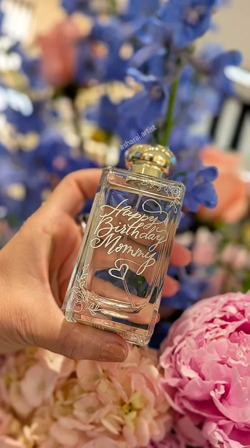 o Malone perfume bottle hand engraved with a Happy Birthday message at Yorkdale boutique.