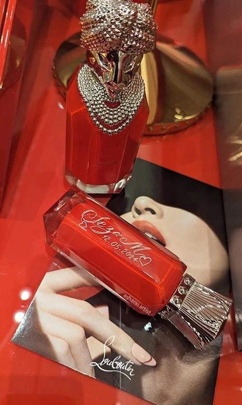 Hand-engraved Christian Louboutin Loubi Crown perfume bottle at Holt Renfrew on Bloor Street, Toronto.