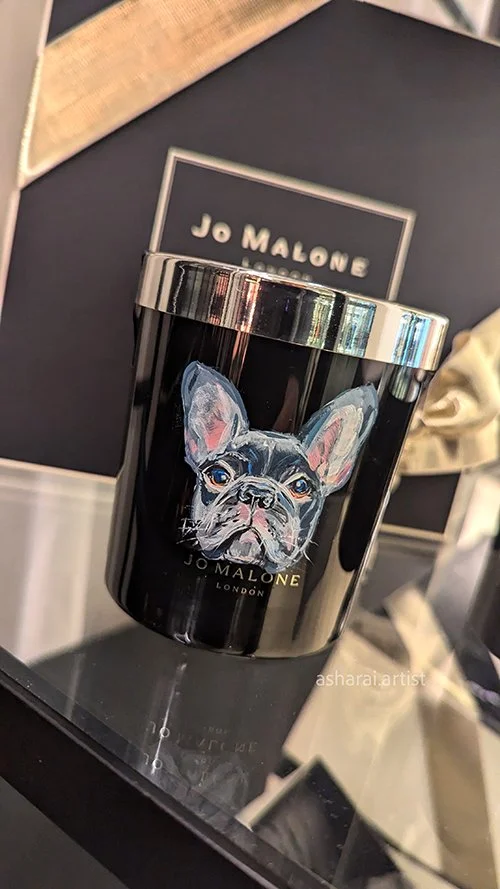 A Jo Malone London candle features a custom painted French Bulldog at Sherway Gradens Boutique