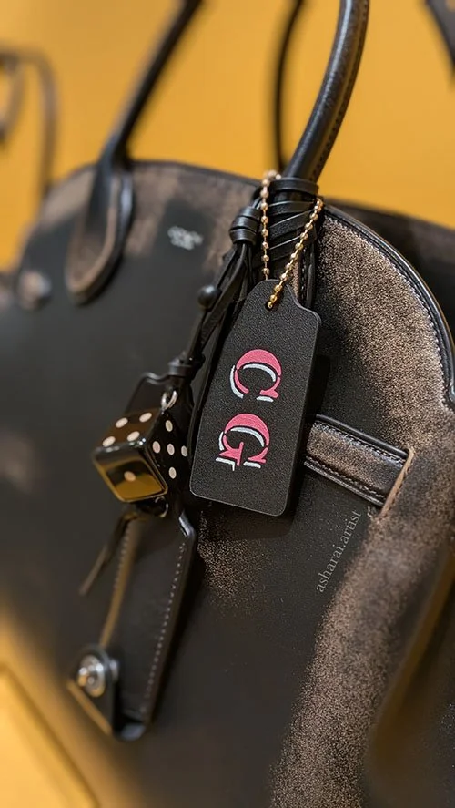 Coach handbag with a custom leather painted tag with initials .Live painting