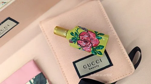 A Gucci fragrance customized with hand painted floral design.