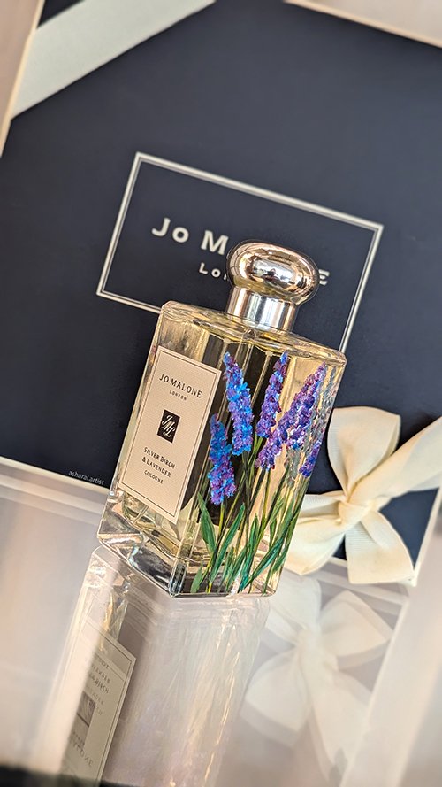 Jo Malone Silver Birch & Lavender Cologne bottle featuring hand-painted lavender flowers, showcasing live bottle painting by an event artist at Yorkdale.