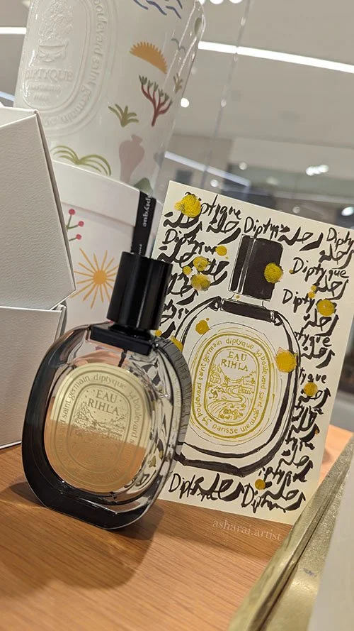 Diptyque Eau Rihla perfume bottle illustrated in watercolor on a postcard, featuring elegant black ink Arabic calligraphy by a live event artist.