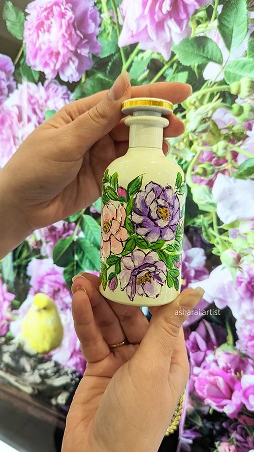 The Alchemist’s Garden Tears From The Moon by Gucci featuring a hand-painted floral design, created live by AshaRai, luxury event artist, at Holt Renfrew Yorkdale. Bottle painting