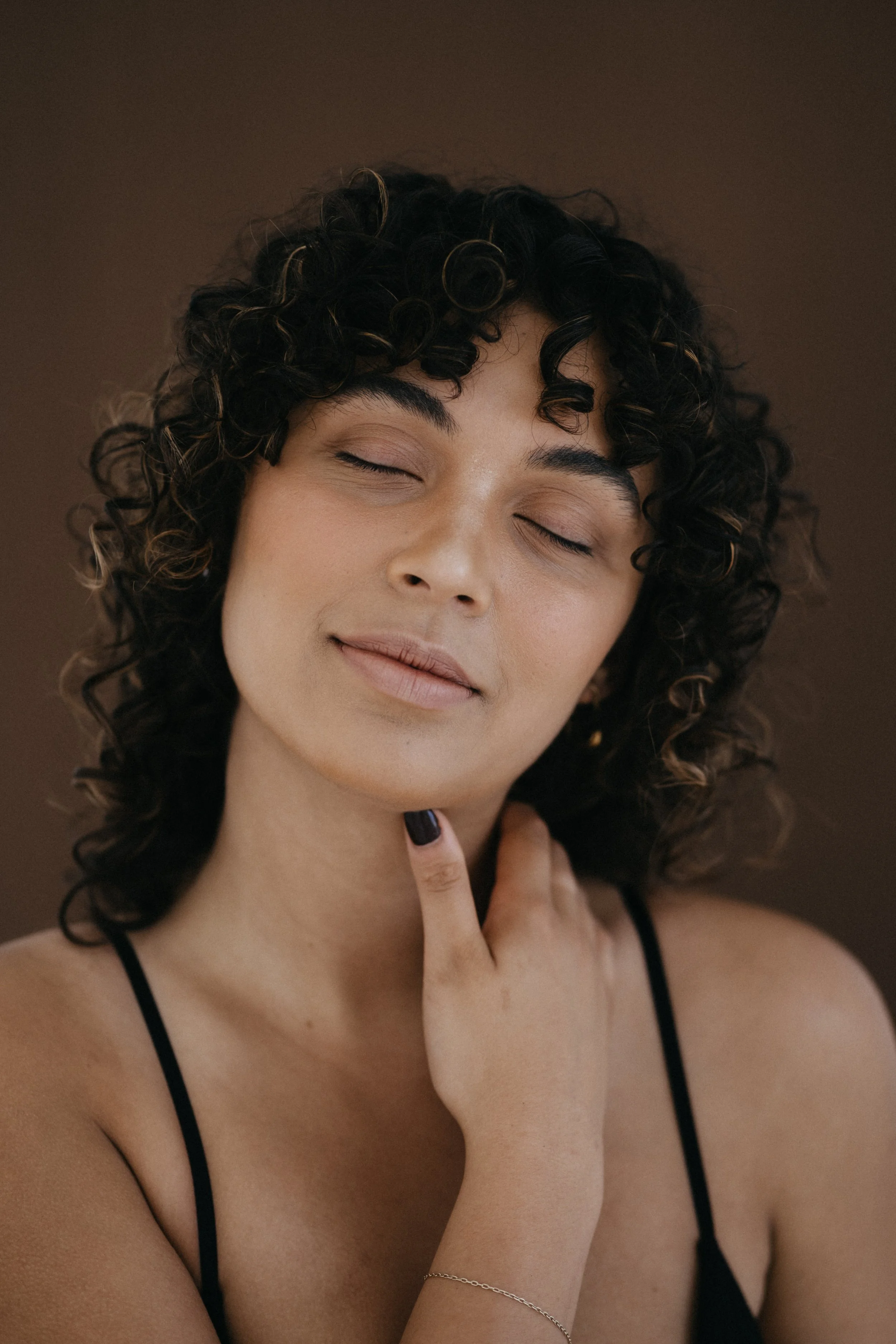 Woman posing with her eyes closed