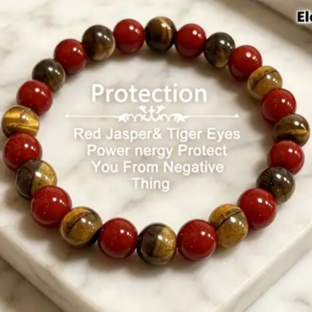 A beaded bracelet with red, yellow, and brown beads, placed on a white surface. The image includes overlay text about protection, mentioning Red Jasper and Tiger Eyes, emphasizing energy protection from negative influences.