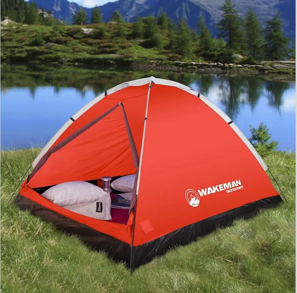 Wakeman Outdoors red and black 2-person dome tent featuring a water-resistant rainfly, D-style mesh zippered door, and white brand logo printed on the front side, isolated on a light gray background.