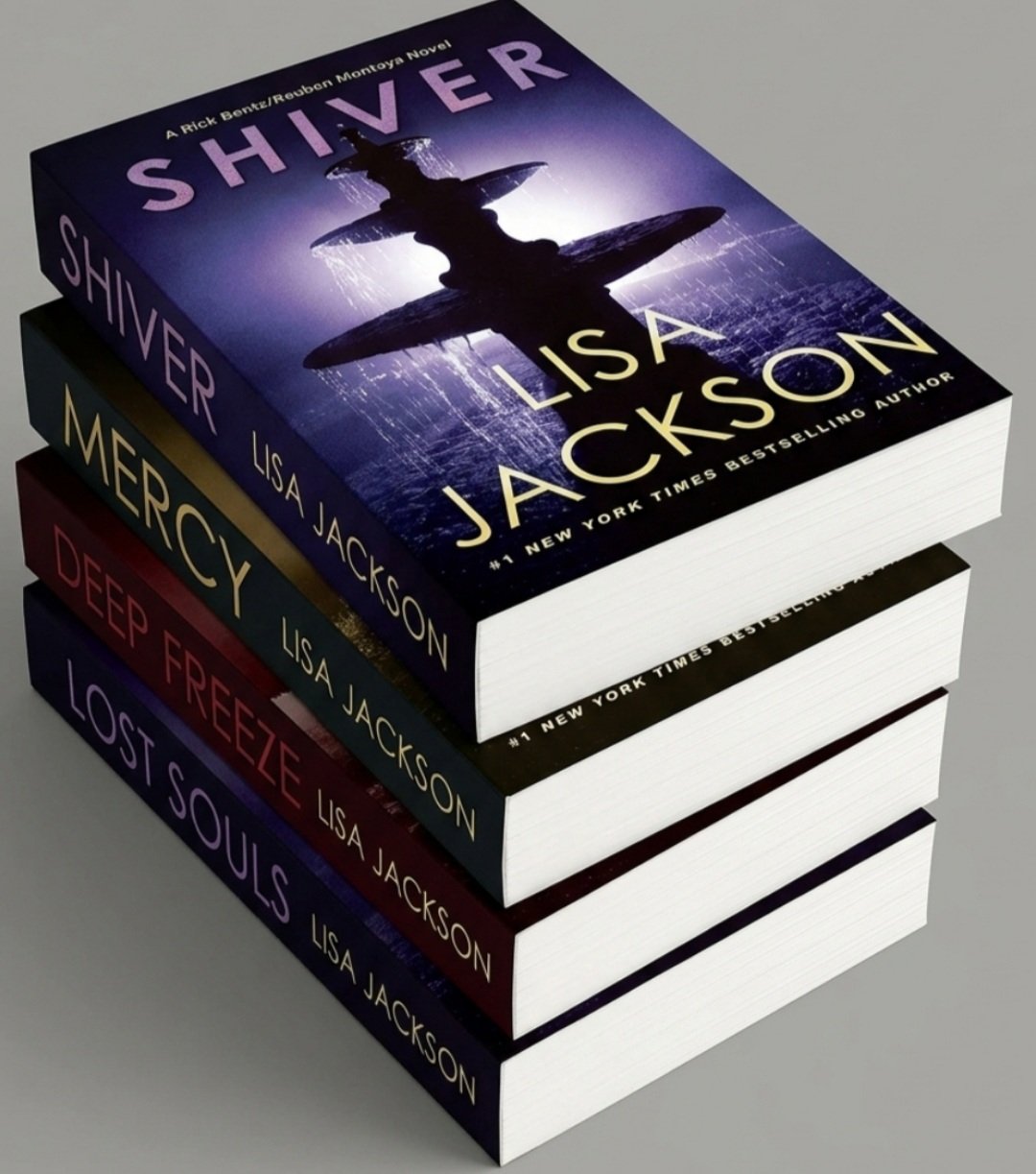 Stack of four Lisa Jackson books, featuring "Shiver" on top, with dark, purple, and blue covers and cityscape backgrounds.
