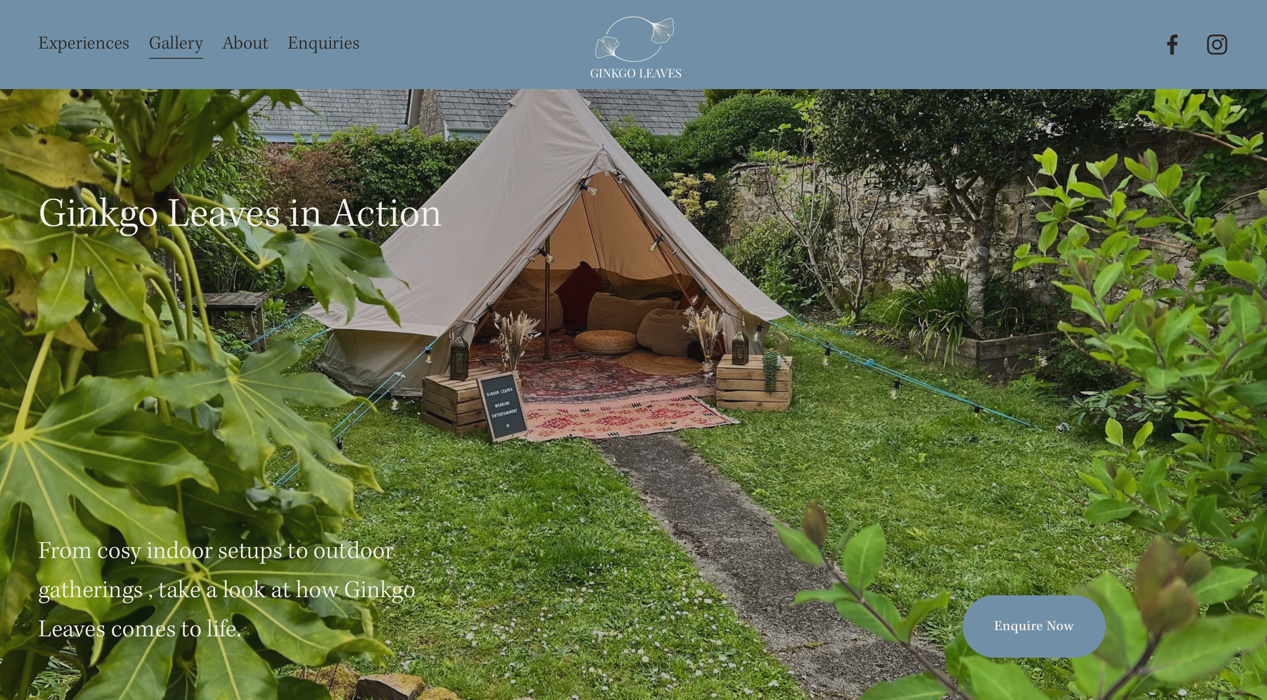 A cozy outdoor garden setup with a large cream-colored teepee tent decorated with cushions, rugs, and small decorative lanterns, surrounded by green plants and trees.