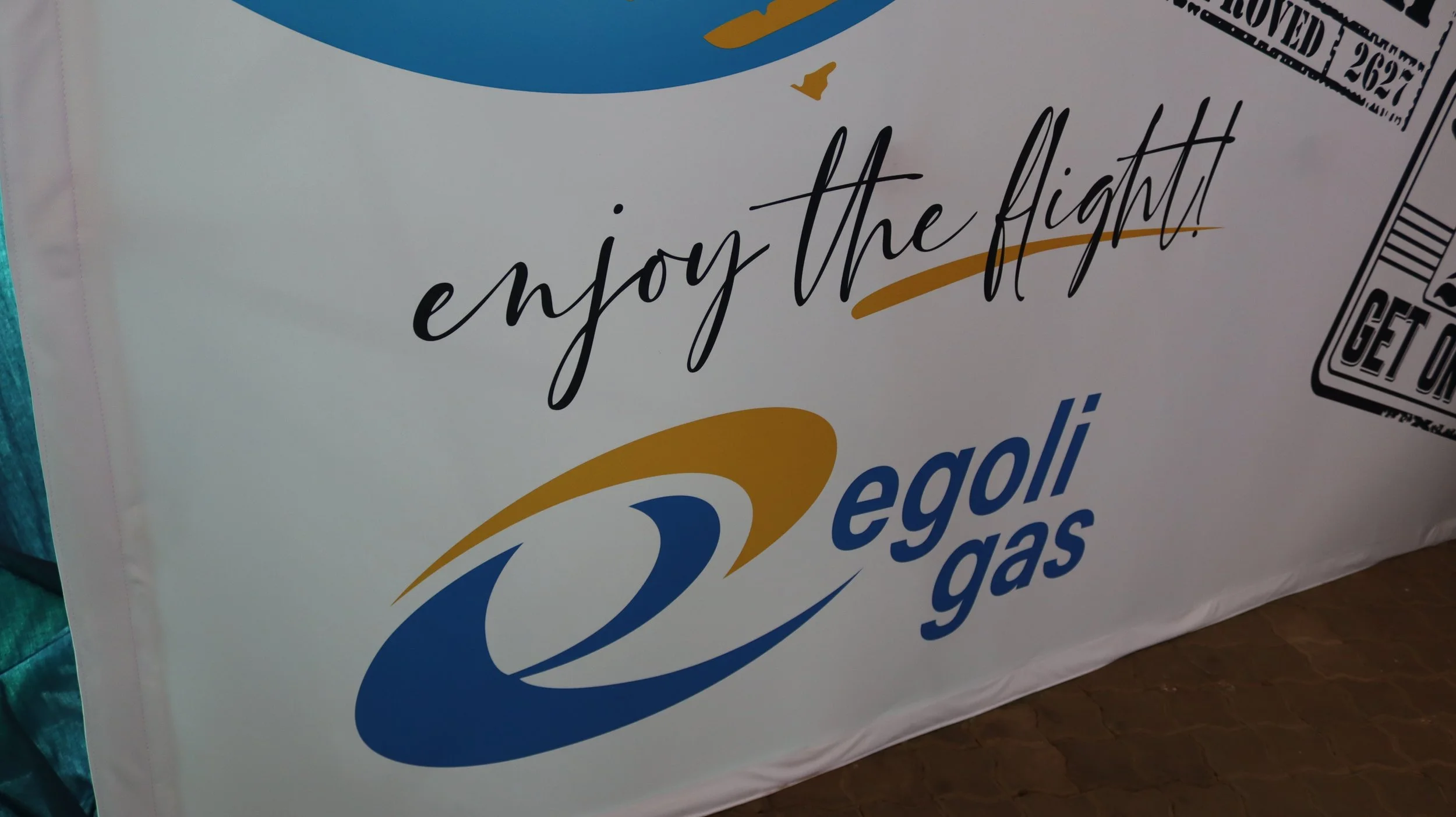 Close-up of a foam box with the phrase 'enjoy the fight' written on it, with part of the logo and barcode visible.