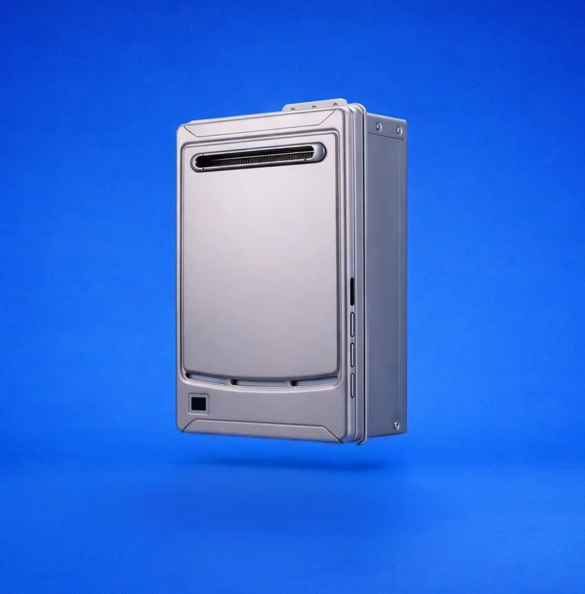 A silver electronic device mounted on a blue wall.